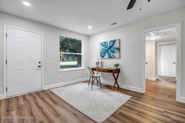 foyer featuring ceiling fan and hardwood / wood-style flooring