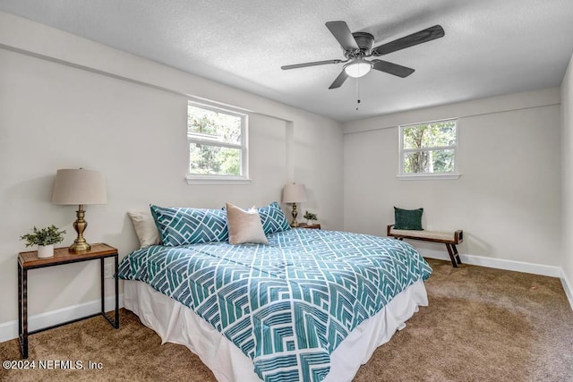 bedroom featuring multiple windows, carpet flooring, and ceiling fan