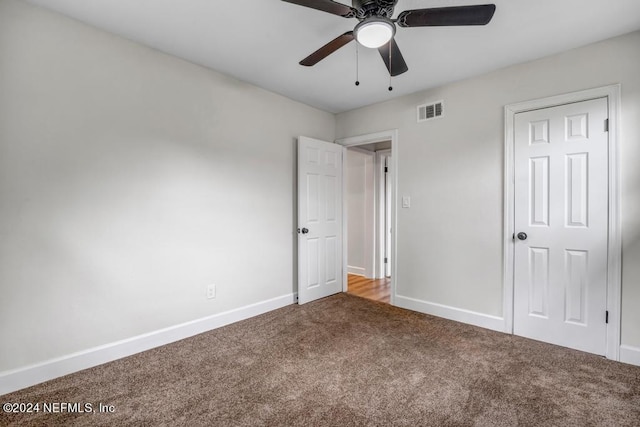 unfurnished bedroom with ceiling fan and carpet flooring