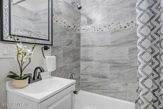 bathroom with shower / bath combo and vanity