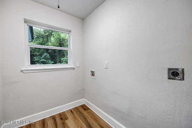 laundry room featuring hookup for a washing machine, hardwood / wood-style flooring, and hookup for an electric dryer