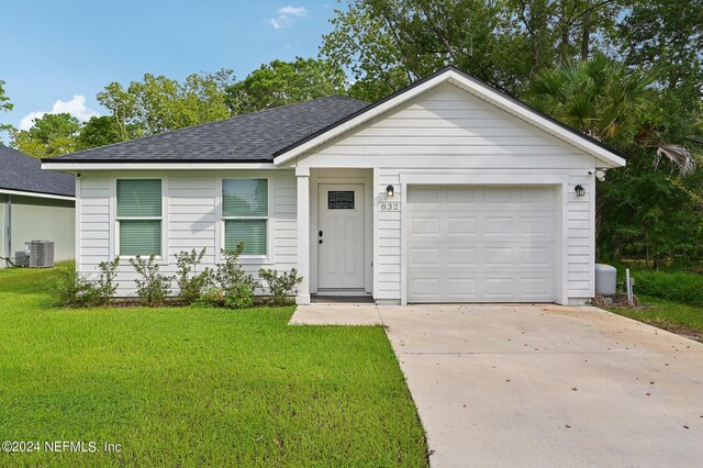 ranch-style house featuring central AC unit, a garage, and a front lawn