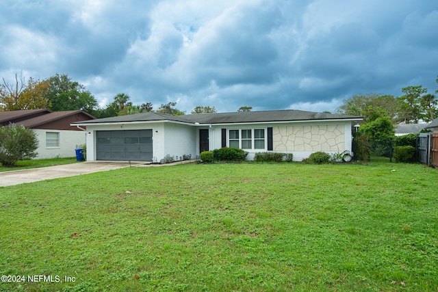 ranch-style house with a garage and a front lawn