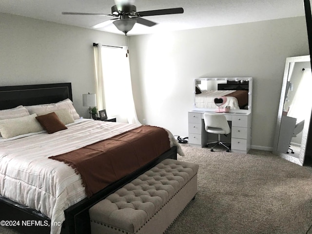 bedroom featuring ceiling fan and carpet