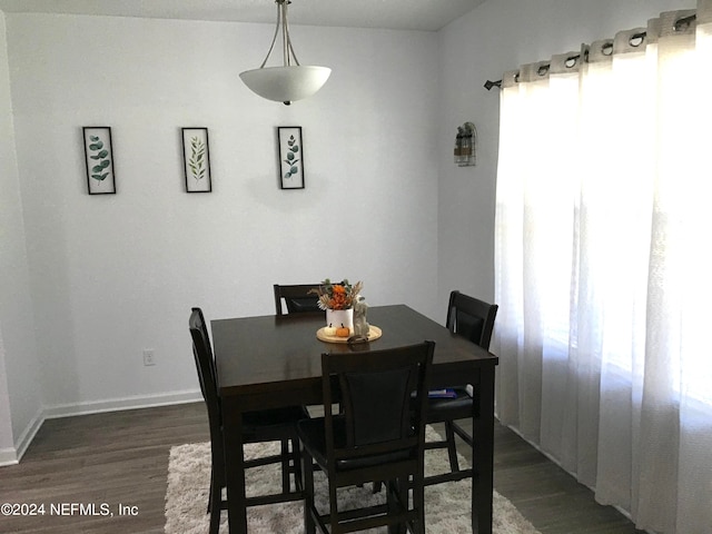 dining area featuring dark hardwood / wood-style flooring