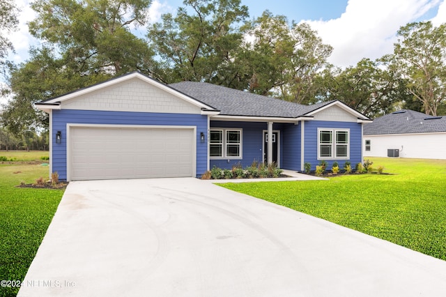 single story home with a front lawn, a garage, and cooling unit