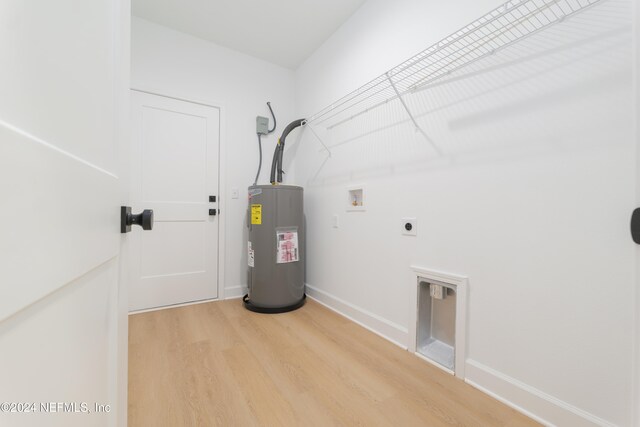 laundry room with electric water heater, light hardwood / wood-style flooring, electric dryer hookup, and hookup for a washing machine