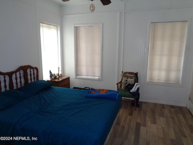 bedroom featuring dark hardwood / wood-style floors and ceiling fan