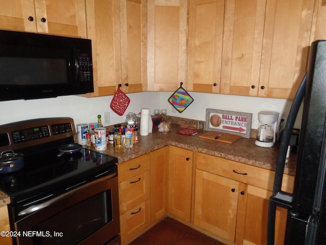 kitchen featuring stone counters and electric range