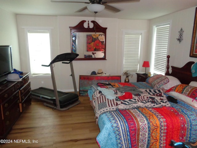 bedroom featuring ceiling fan and hardwood / wood-style floors