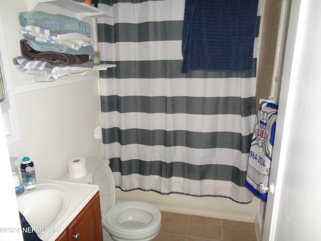 full bathroom featuring tile patterned flooring, vanity, toilet, and shower / tub combo with curtain