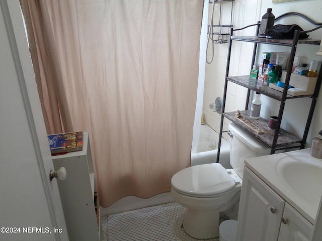 full bathroom featuring tile patterned floors, vanity, toilet, and shower / tub combo with curtain