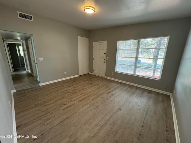 empty room featuring hardwood / wood-style flooring