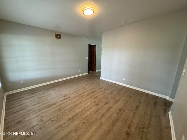 empty room featuring hardwood / wood-style floors