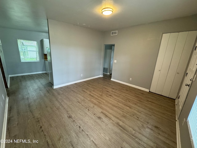 unfurnished bedroom featuring hardwood / wood-style flooring