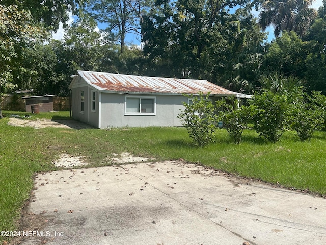 view of property exterior featuring a yard