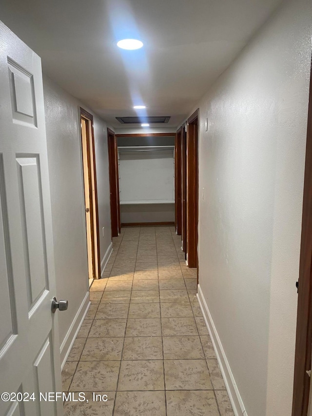 hallway with light tile patterned flooring