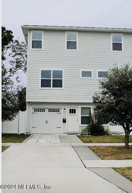 view of front of property with a garage