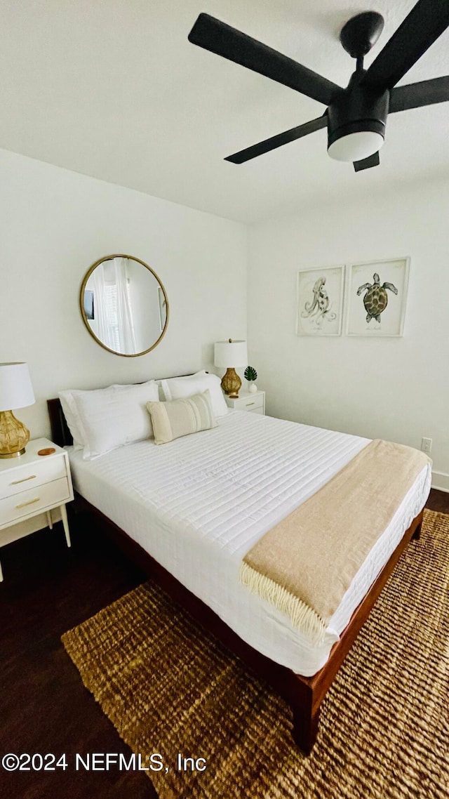 bedroom featuring ceiling fan and dark hardwood / wood-style flooring