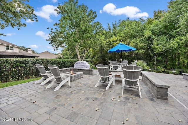 view of patio / terrace featuring a fire pit