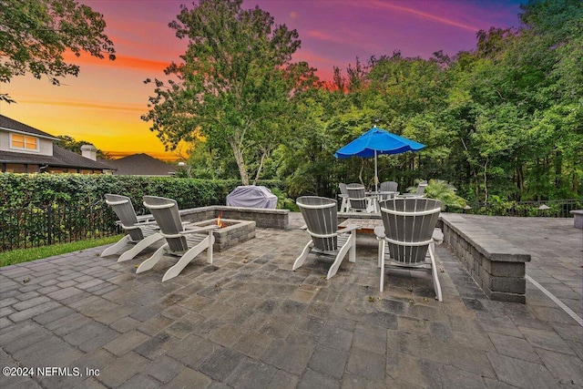 patio terrace at dusk with an outdoor fire pit