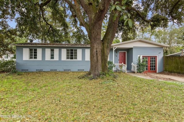 6124 Sudbury Ave S, Jacksonville, FL 32210 - ranch-style home with fence, french doors, crawl space, and a front yard