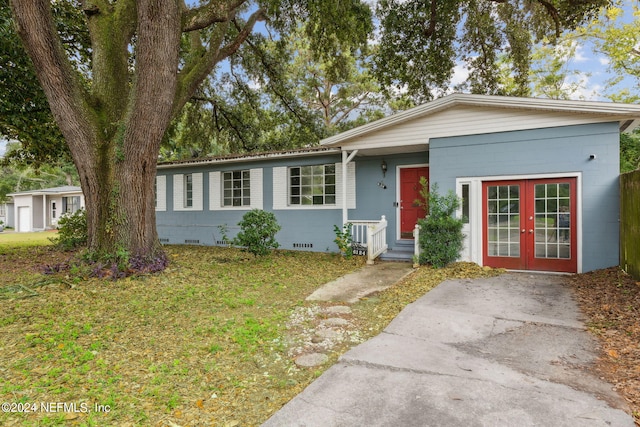 6124 Sudbury Ave S, Jacksonville, FL 32210 - single story home with a front lawn, french doors, crawl space, and entry steps