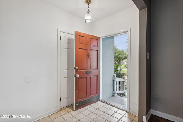 entrance foyer with light tile patterned floors