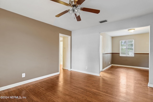 6124 Sudbury Ave S, Jacksonville, FL 32210 - unfurnished room with baseboards, visible vents, wood finished floors, and a ceiling fan