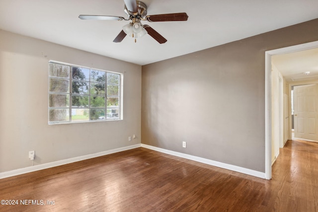 spare room featuring ceiling fan and hardwood / wood-style flooring