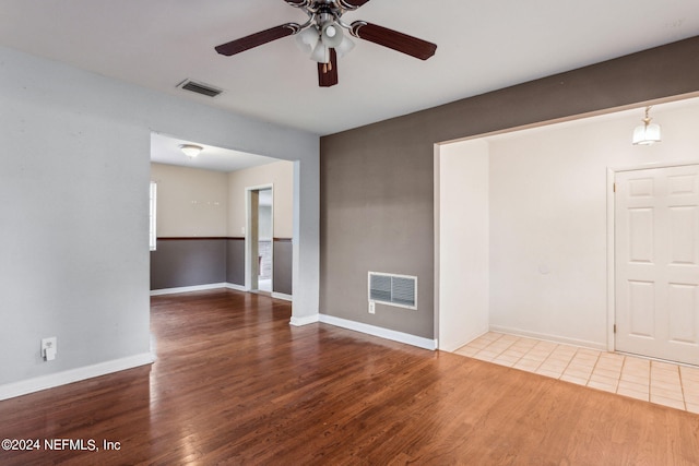 spare room featuring ceiling fan and hardwood / wood-style flooring