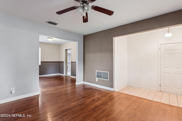 6124 Sudbury Ave S, Jacksonville, FL 32210 - spare room featuring wood finished floors, baseboards, ceiling fan, and visible vents