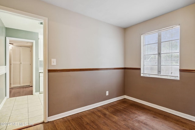 spare room with hardwood / wood-style flooring