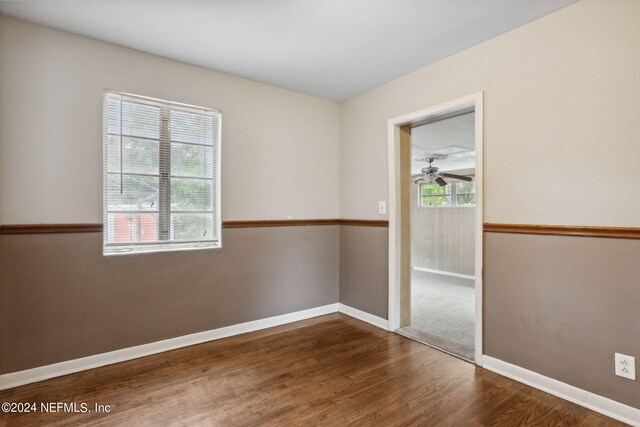 6124 Sudbury Ave S, Jacksonville, FL 32210 - spare room featuring baseboards and wood finished floors