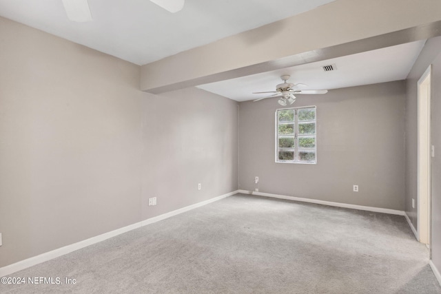 unfurnished room featuring carpet and ceiling fan