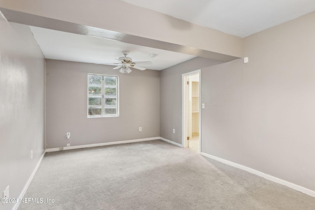 unfurnished room with ceiling fan and light colored carpet