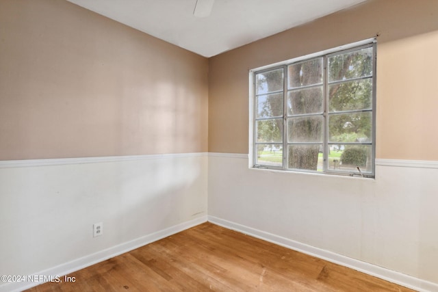 6124 Sudbury Ave S, Jacksonville, FL 32210 - empty room with a ceiling fan, baseboards, and wood finished floors