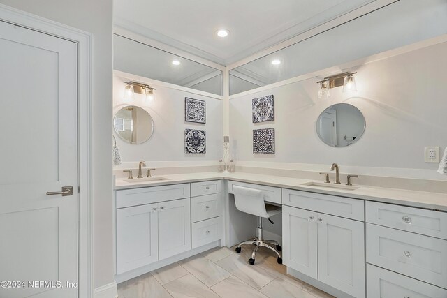 bathroom featuring vanity and crown molding