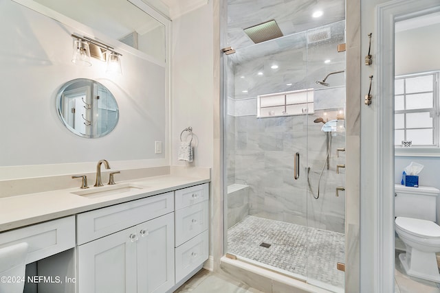 bathroom with vanity, tile patterned flooring, toilet, and an enclosed shower