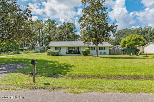 ranch-style house with a front yard