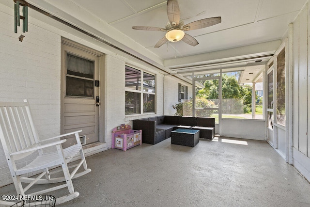 sunroom / solarium featuring ceiling fan