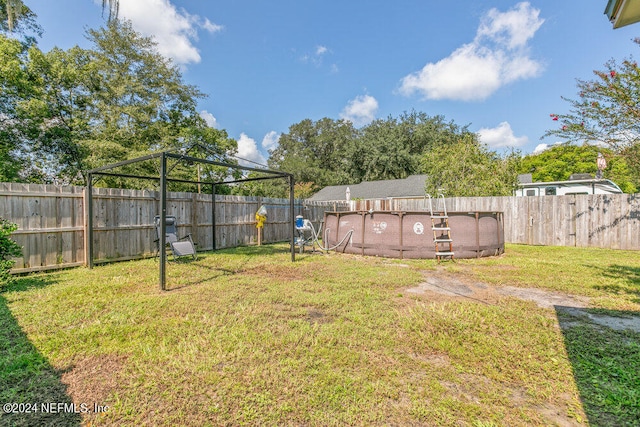 view of yard featuring a fenced in pool