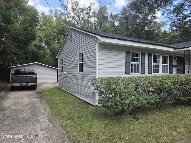 view of side of home featuring a yard