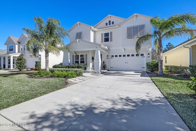 view of front facade featuring a garage and a front yard