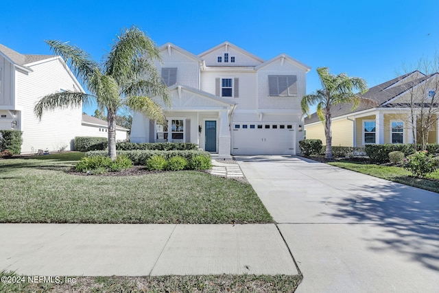 view of front facade featuring a front yard and a garage