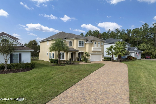 view of front of house featuring a front lawn and a garage