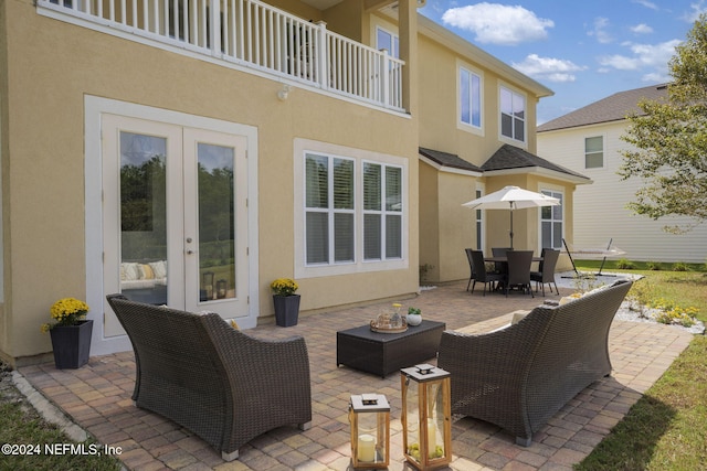 view of patio featuring an outdoor living space and a balcony