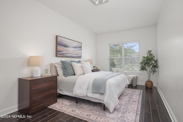 bedroom featuring dark wood-type flooring