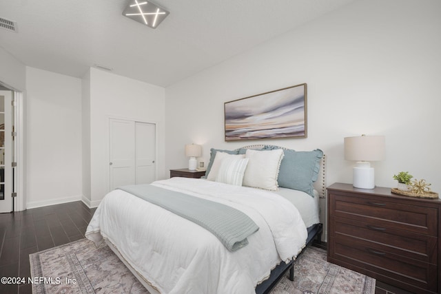 bedroom featuring a closet and wood-type flooring