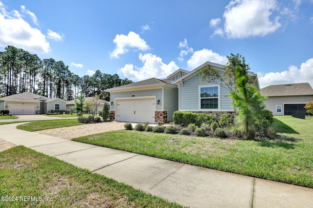 view of front of house featuring a front yard and a garage